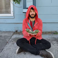 a man wearing a red hoodie